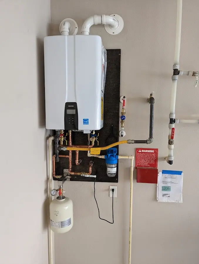 Professional plumber installing copper piping in a Morgan Hill home